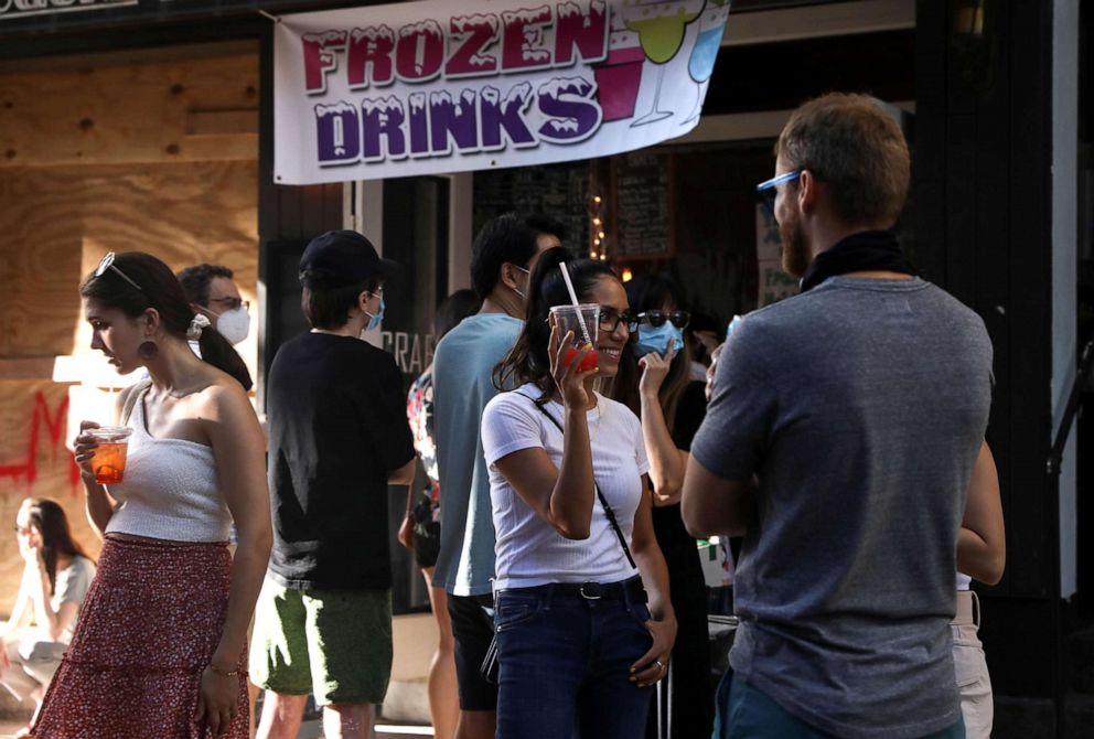 PHOTO: People drink outside a bar during the reopening phase following the coronavirus disease (COVID-19) outbreak in the East Village neighborhood of New York, June 13, 2020. 