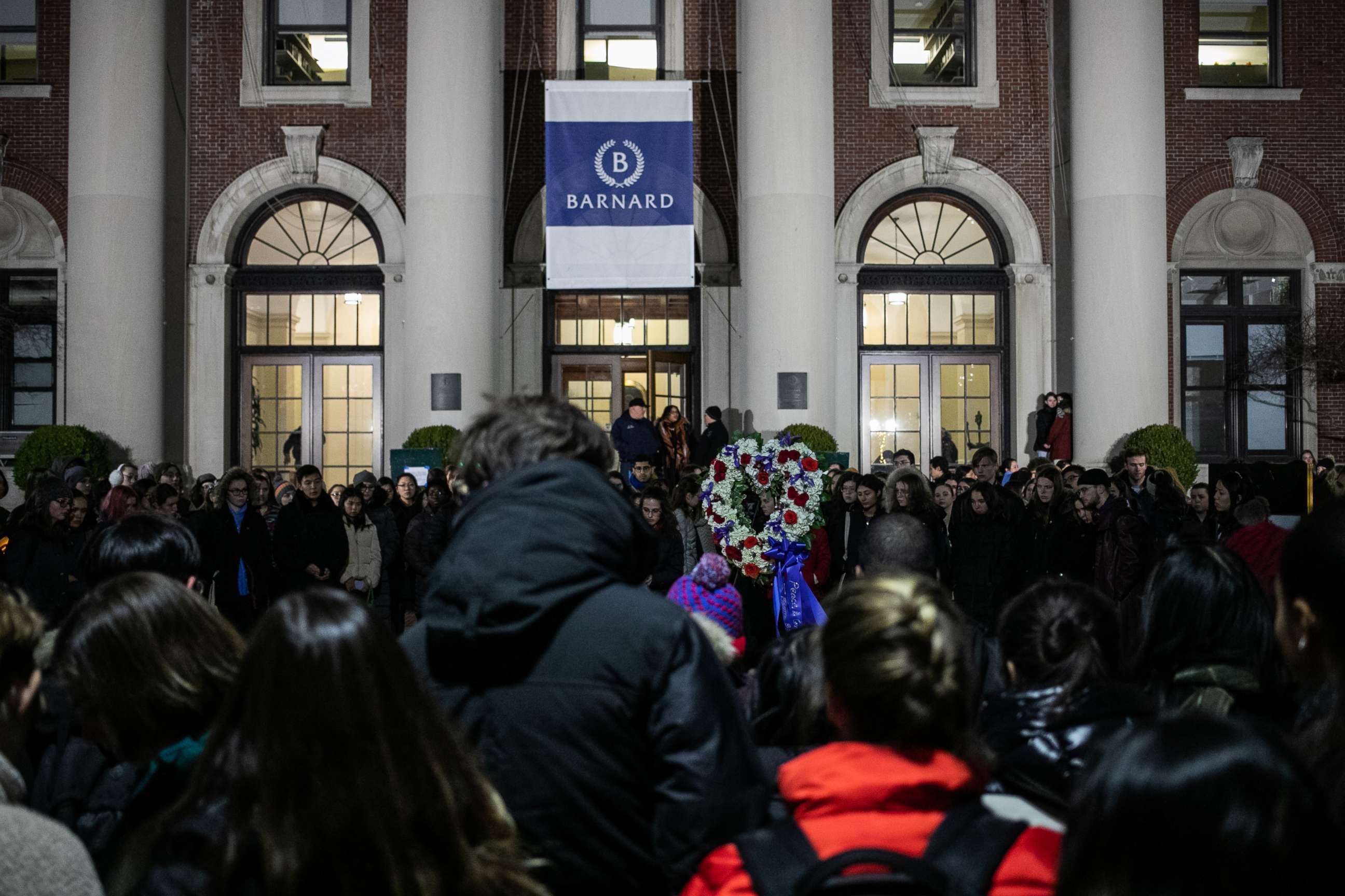 PHOTO: Students gather at the entrance of Barnard College in New York City during a vigil held for slain 18-year-old Tessa Majors on Dec. 12, 2019,
