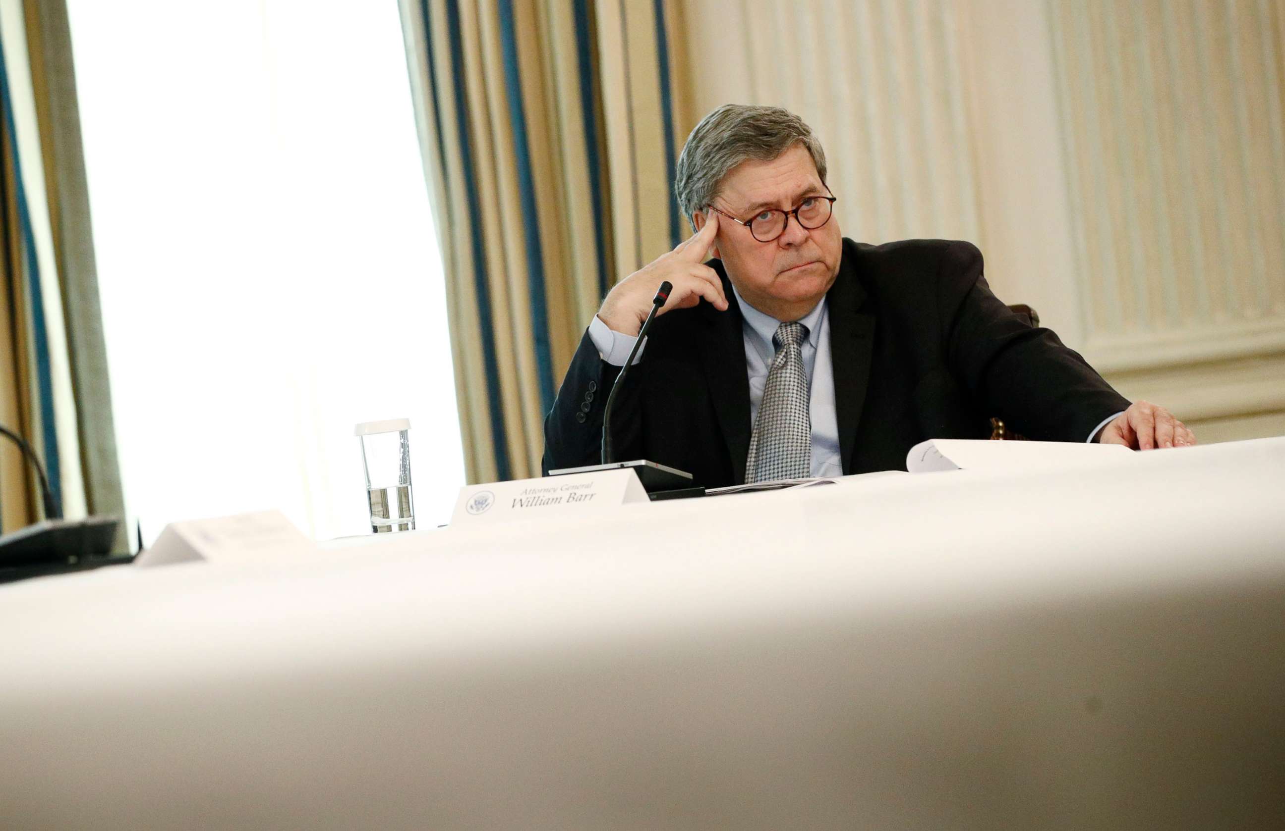 PHOTO: Attorney General William Barr listens during a roundtable discussion with law enforcement officials, June 8, 2020, in the State Dining Room of the White House.