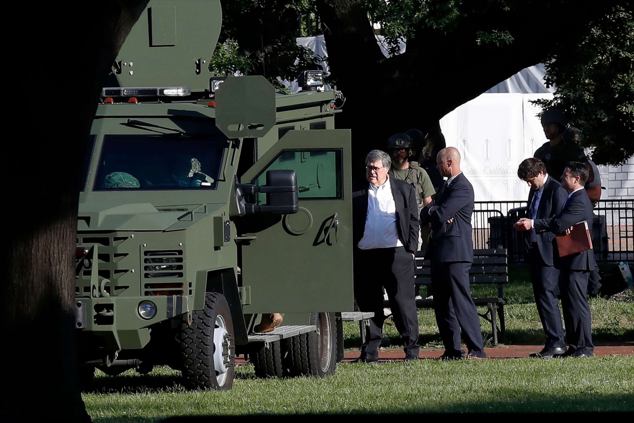 PHOTO: Attorney General William Barr, center, stands in Lafayette Park across from the White House as demonstrators gather to protest the death of George Floyd, June 1, 2020, in Washington, D.C.