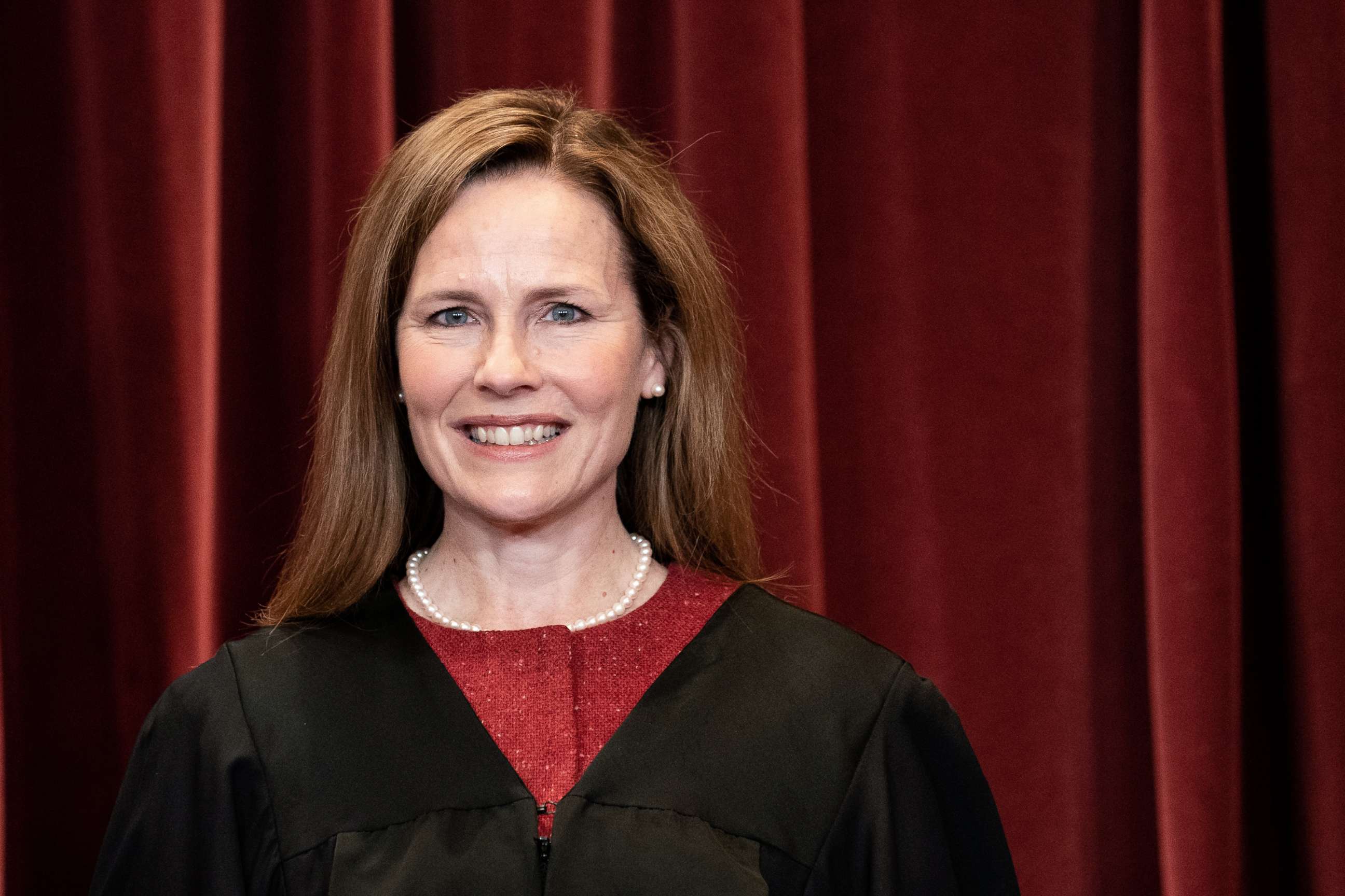 PHOTO: Associate Justice Amy Coney Barrett stands during a group photo of the Justices at the Supreme Court in Washington, D.C., April 23, 2021.