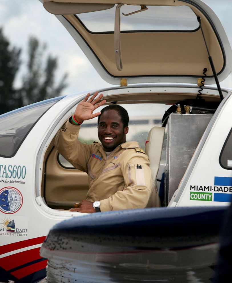 PHOTO: Barrington Irving Jr. waves as the 23-year-old arrives home to become the youngest person and first black pilot to circumnavigate the globe solo, June 27, 2007, at the airport in Opa Locka, Florida.