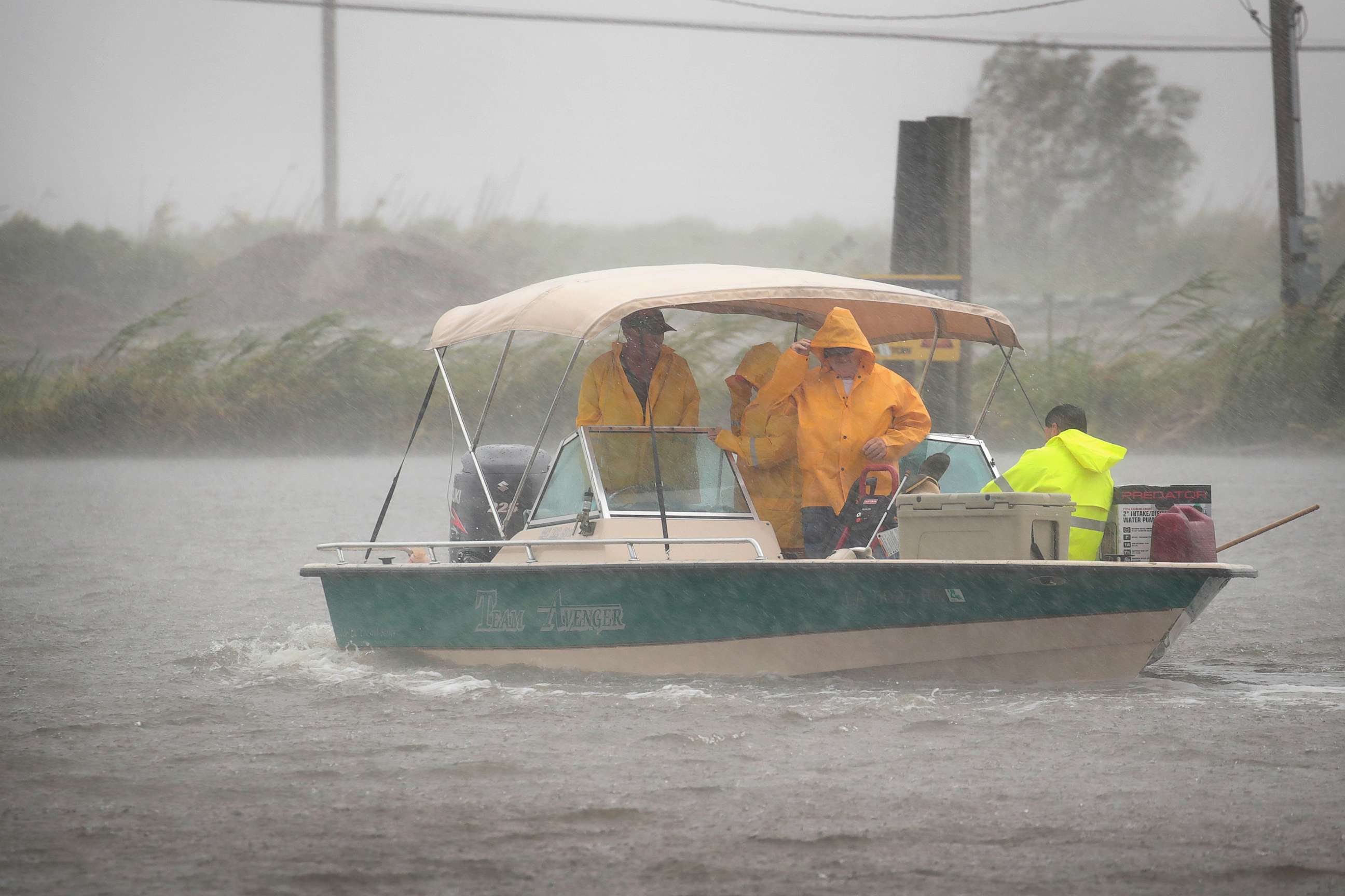 PHOTO: Boaters head out in a driving rain to survey damage to their fish camps in the wake of Hurricane Barry, July 14, 2019, in Myrtle Grove, La. 
