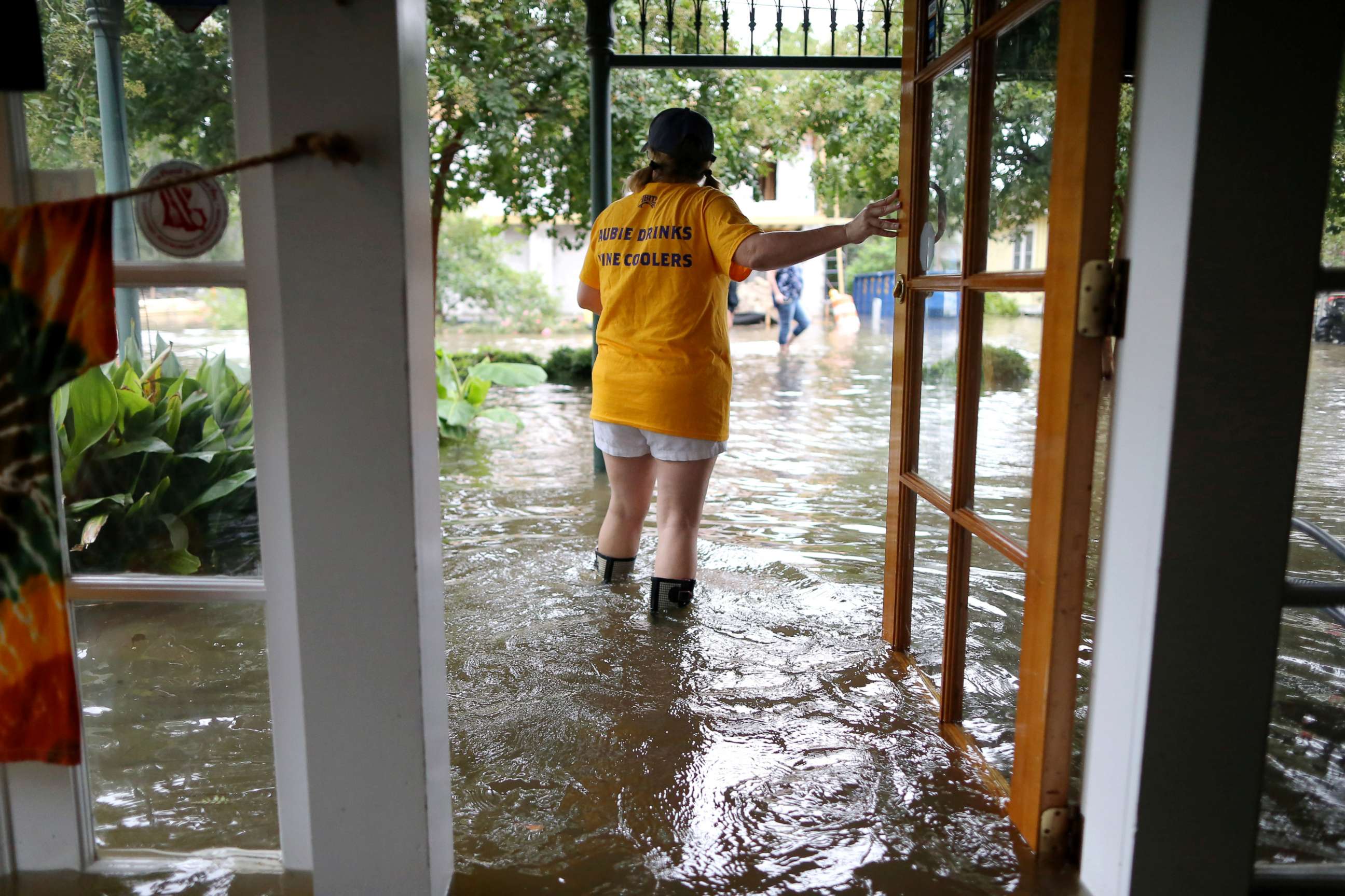PHOTO: Robyn Iacona-Hilbert stands outside her flooded business after Hurricane Barry came ashore in Mandeville, La., on Saturday, July 13, 2019.