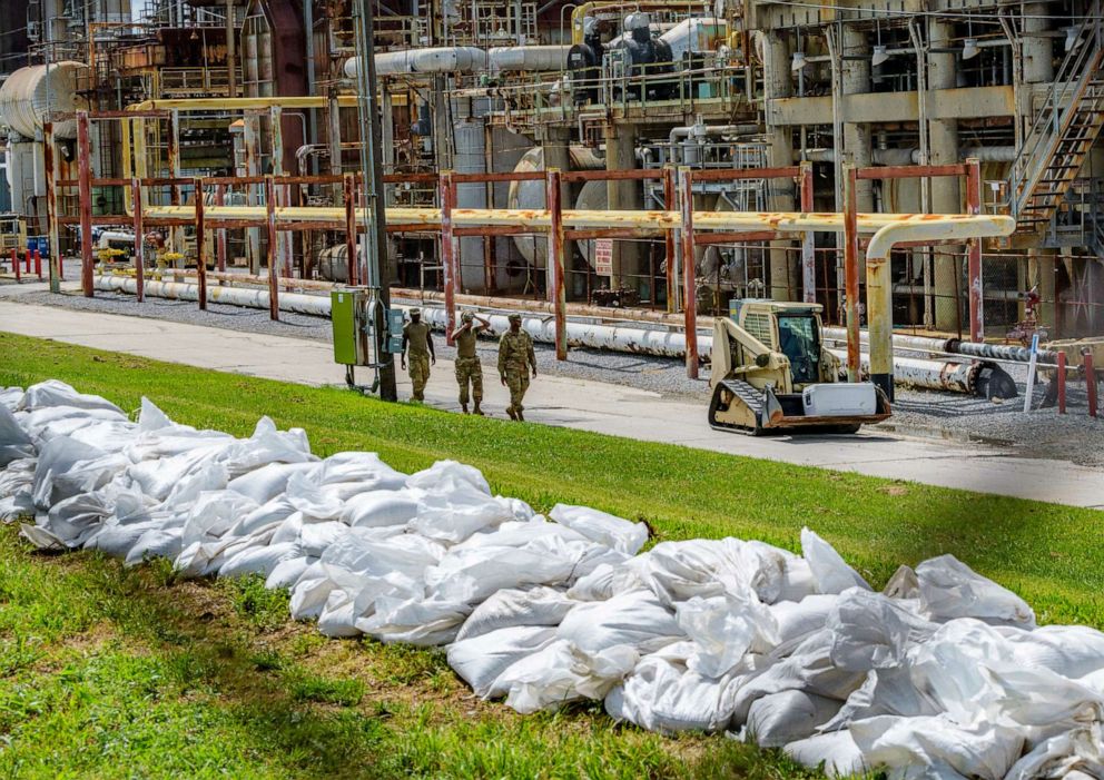 PHOTO: Soldiers with the U.S. Army National Guard work on adding sandbags to levees by the Chalmette Refining plant in Chalmette, La., July 11, 2019, ahead of Tropical Storm Barry.