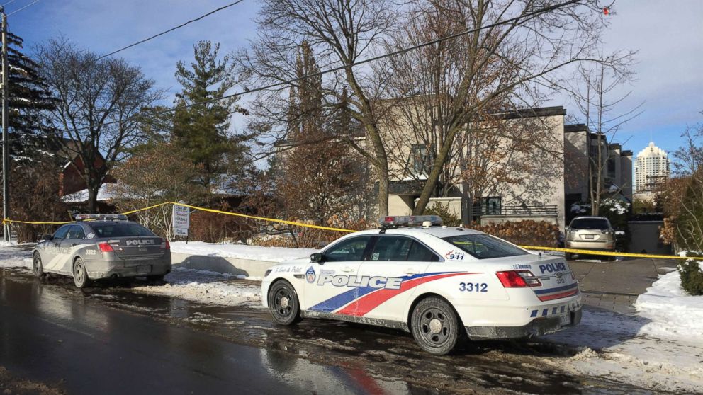 Police cars are parked outside the home of billionaire Barry Sherman, Dec. 17, 2017 in Toronto.