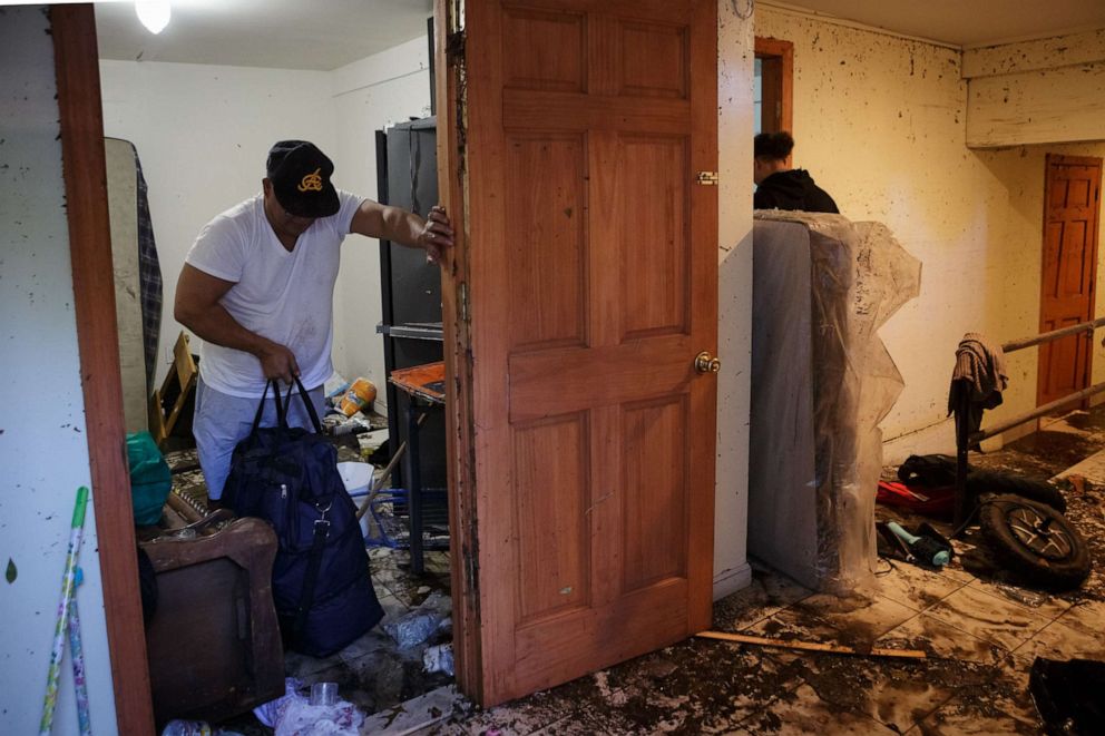 PHOTO: Ricardo Garcia salvages what he can from his water-damaged basement apartment in Brooklyn on Sept. 2, 2021.