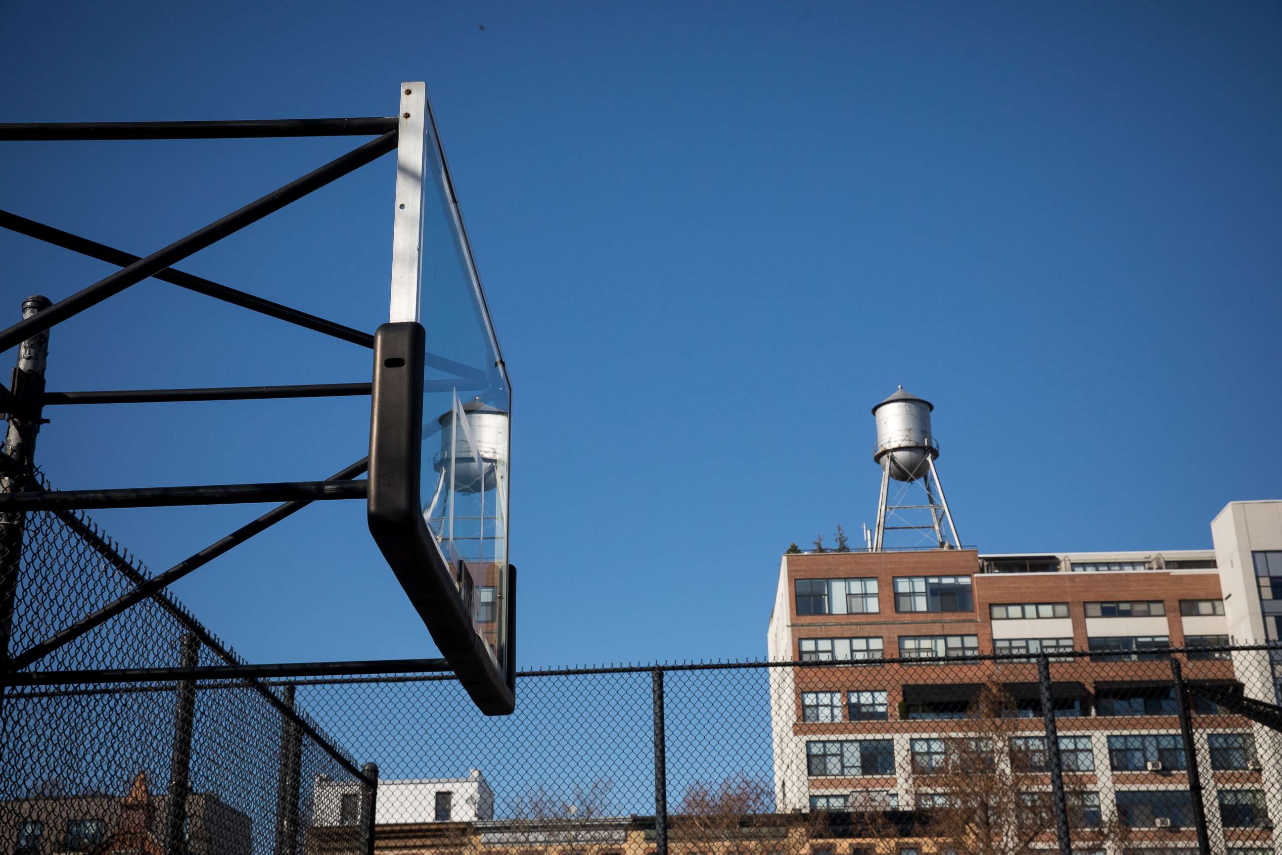 PHOTO: A basketball backboard stands without hoop, after it was removed to prevent people from spreading coronavirus by gathering in Brooklyn, New York, March 27, 2020. 