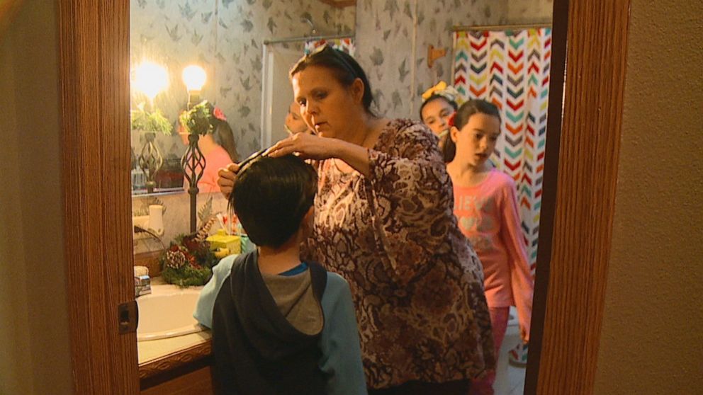 PHOTO: 12 people live in the house with two bathrooms, so Terri has given each of her children a small container to hold all their personal toiletries.