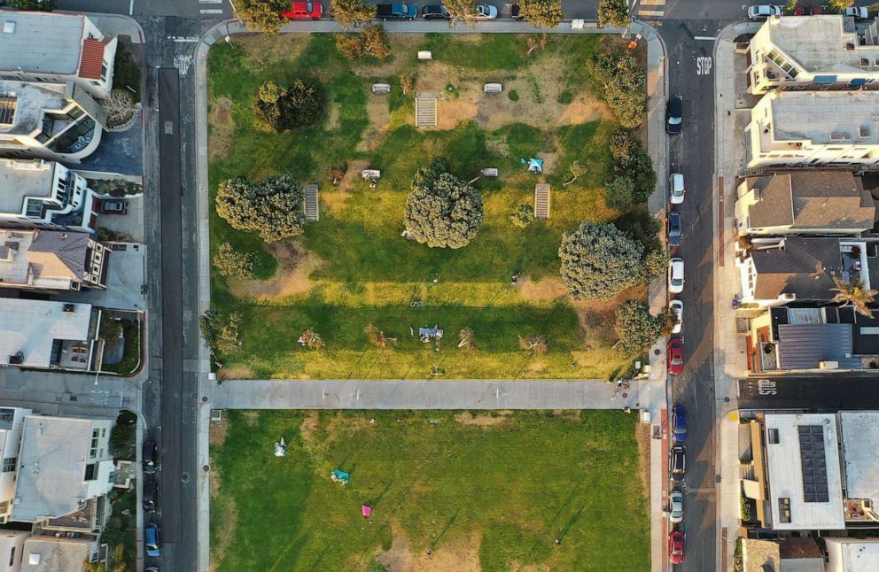 PHOTO: In an aerial view, people gather in Bruce's Beach Park, between expensive real estate, April 19, 2021, in Manhattan Beach, Calif.