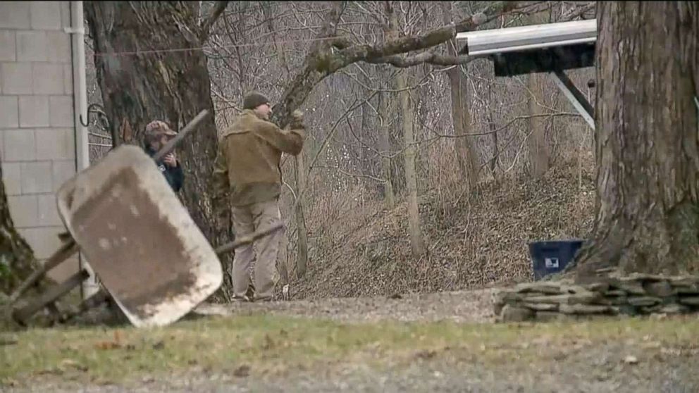 PHOTO: Game wardens search for a bear that attacked a woman and dragged her 88 yards in her front yard.