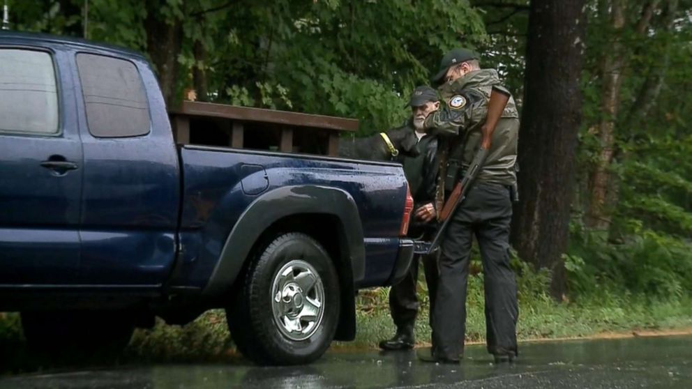 PHOTO: A team from the New Hampshire Fish and Game Department searches the area after a 71-year-old woman was attacked by a bear that entered her home in Groton, N.H., early in the morning on July 17, 2018.