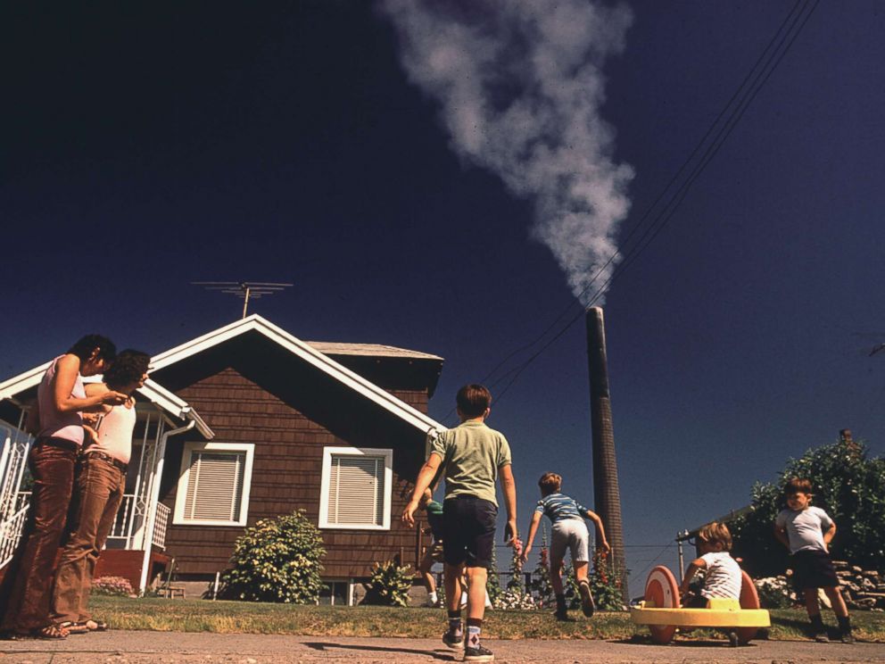 PHOTO: Children play in the yard of a home in Ruston, Wash. while a Tacoma smelter emits arsenic and lead residue in August 1972.