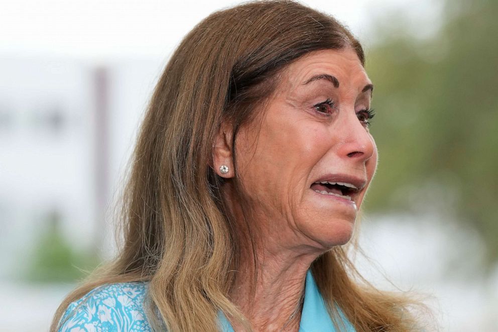 PHOTO: Linda Beigel Schulman, mother of Scott Beigel, is overcome with emotion as she talks to journalists about visiting the scene where her son and 16 others were killed, at Marjory Stoneman Douglas High School in Parkland, Fla., July 5, 2023.