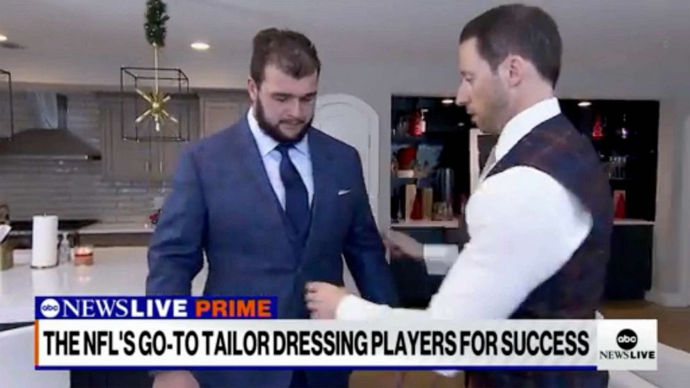 PHOTO: New York Giants lineman Ben Bredeson tries on a suit made by Tom Marchitelli.