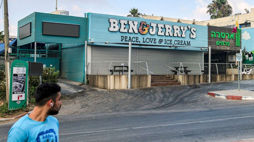 PHOTO: A man walks past a closed "Ben & Jerry's" ice-cream shop in the Israeli city of Yavne, about 30 kilometres south of Tel Aviv, on July 23, 2021.