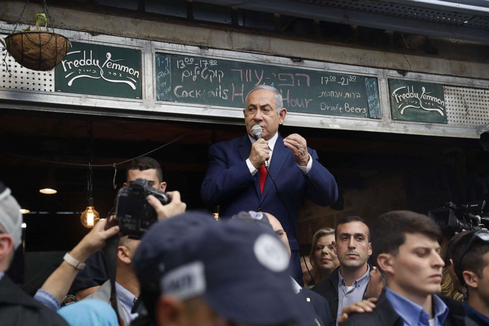 PHOTO: Israeli Prime Minister Benjamin Netanyahu, leader of the Likud party, addresses his supporters at the main market of Jerusalem, April 8, 2019, a day ahead of the electoral polls.