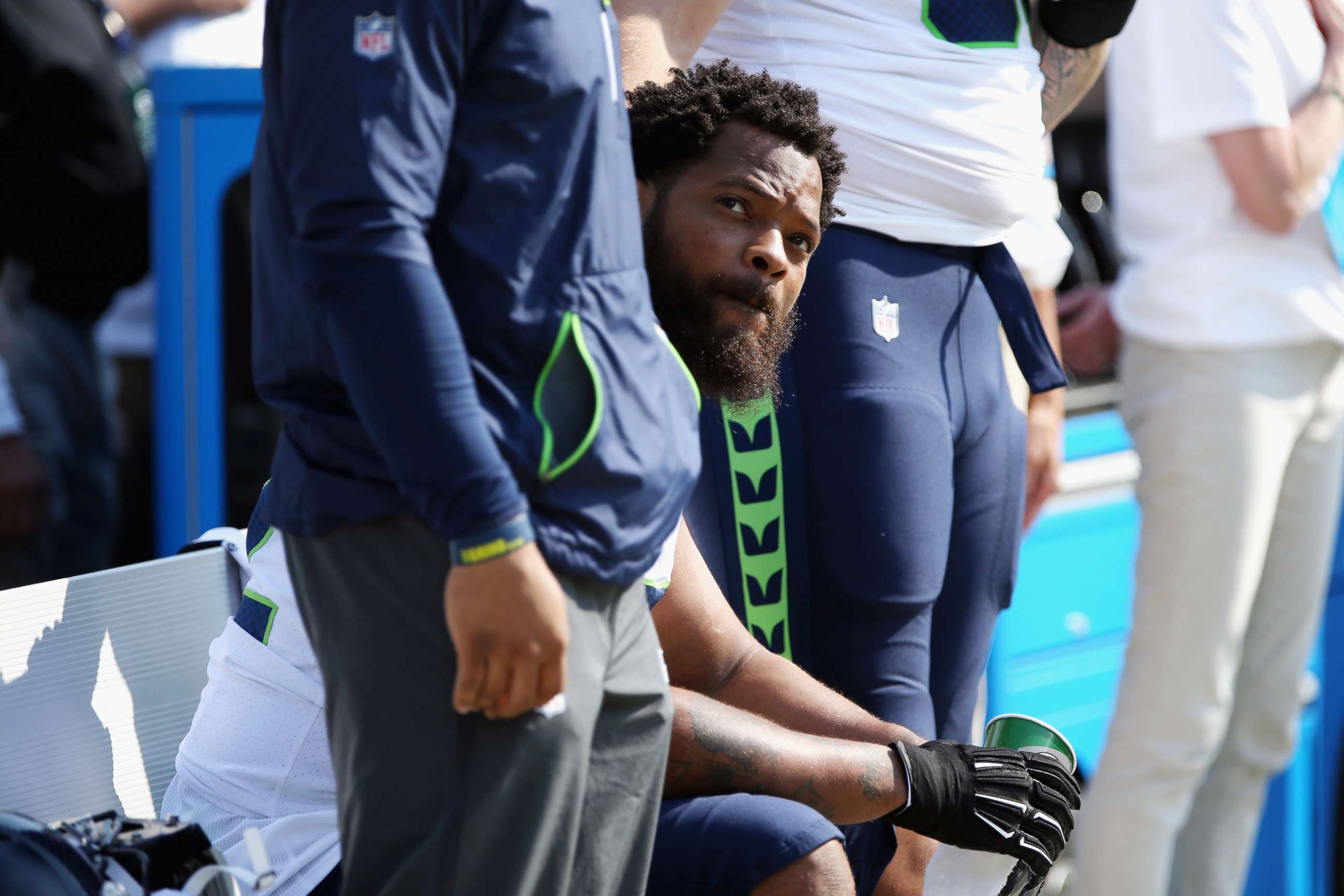 PHOTO: Michael Bennett #72 of the Seattle Seahawks sits on the bench during the national anthem prior to the game against the Green Bay Packers at Lambeau Field on September 10, 2017 in Green Bay, Wisconsin.