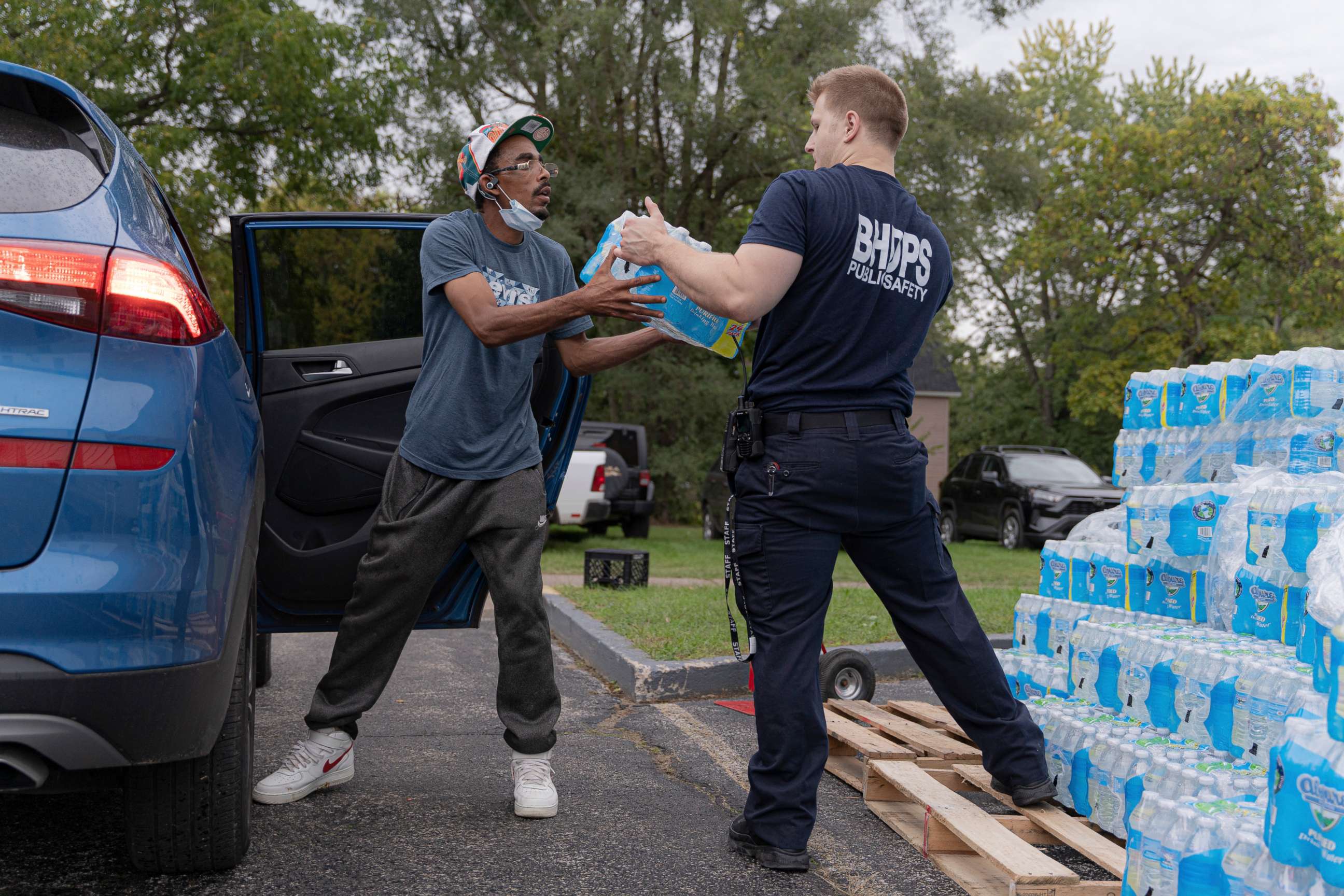 PHOTO: A resident receives bottled water distributed by the Department of Public Safety in Benton Harbor, Mich., Oct. 13, 2021.