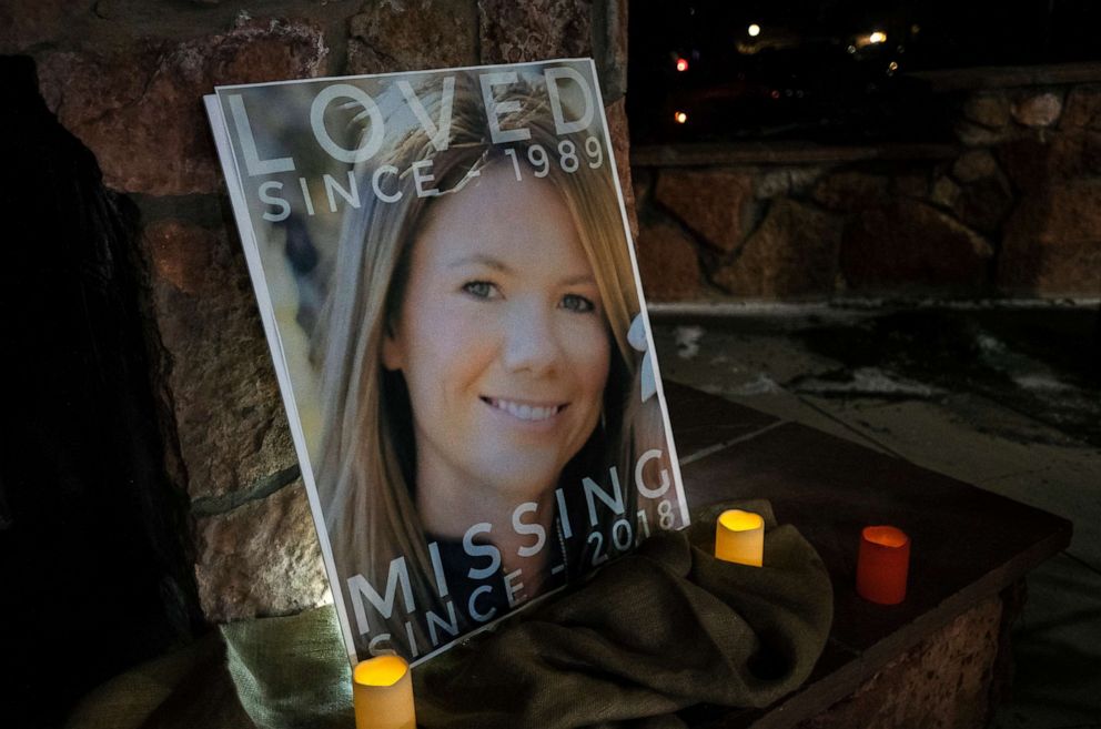 PHOTO: In this Dec. 13, 2018 file photo, a poster with the picture of missing Kelsey Berreth is propped up with candles for a vigil at Memorial Park in Woodland Park, Colo.