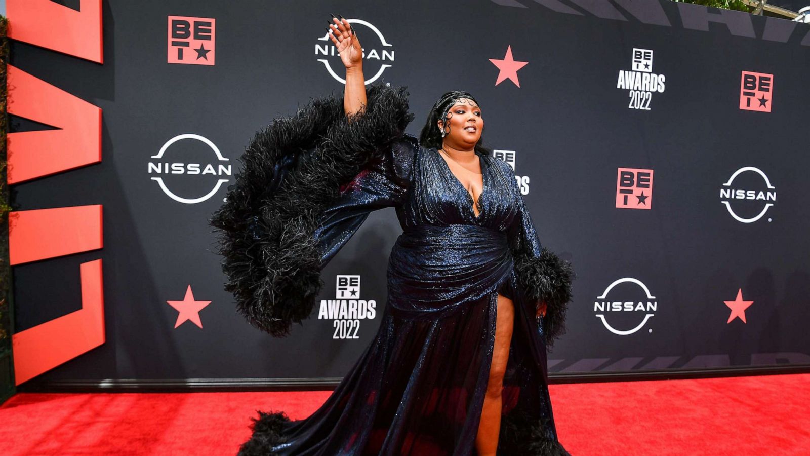 Lizzo shows off her legs in sexy strapless minidress with stunning