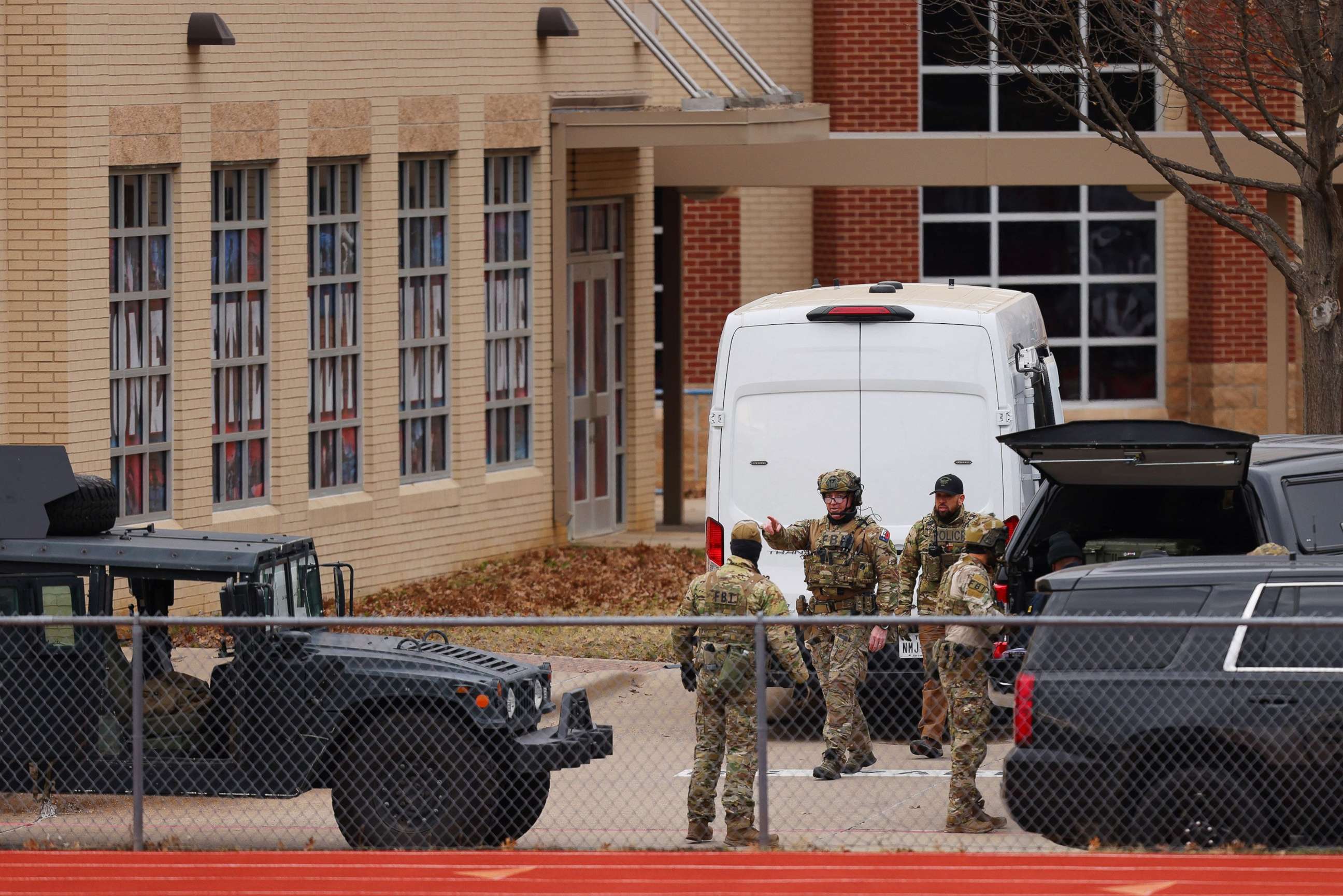 PHOTO: SWAT team members deploy near the Congregation Beth Israel Synagogue in Colleyville, Texas, Jan. 15, 2022.