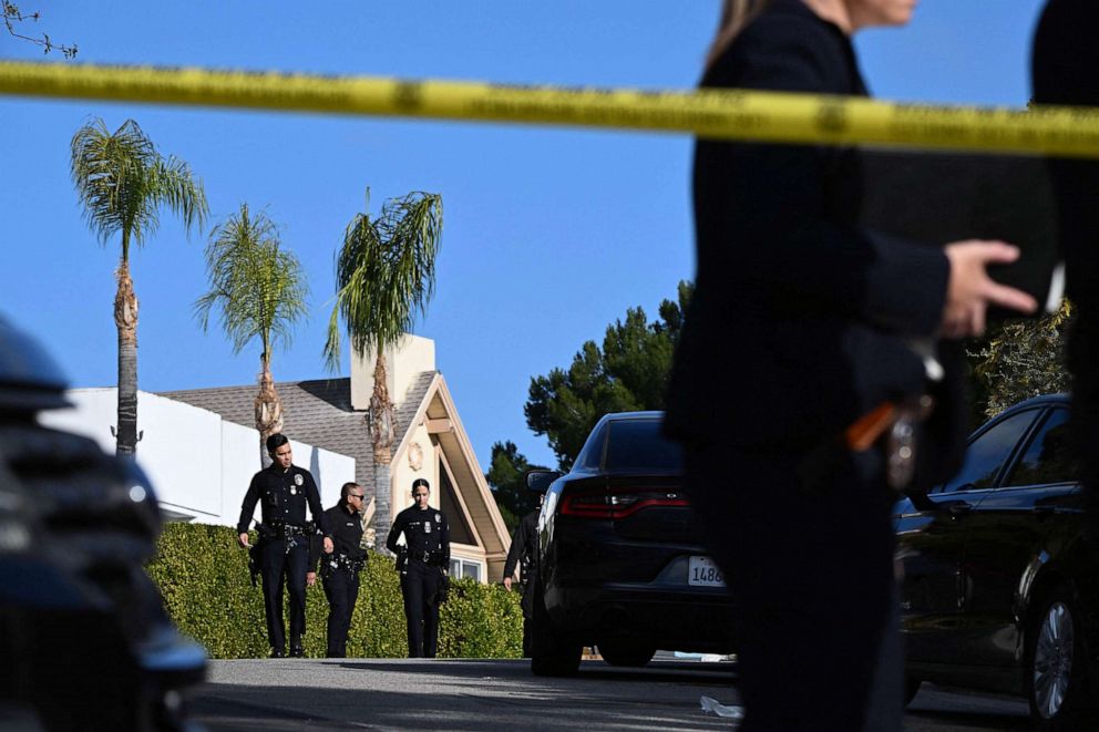 PHOTO: Law enforcement work an investigation of an early morning shooting that left three people dead and four wounded, Jan. 28, 2023, in the Beverly Crest neighborhood of Los Angeles, just north of Beverly Hills.