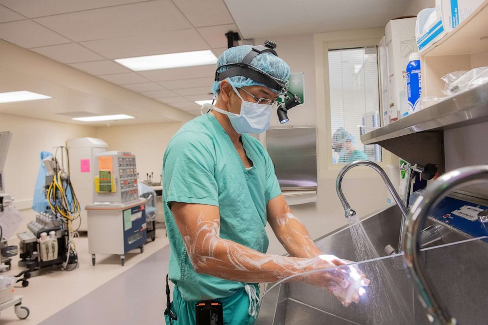 PHOTO: Northwestern Memorial Hospital’s chief thoracic surgeon Dr. Ankit Bharat prepares for surgery.