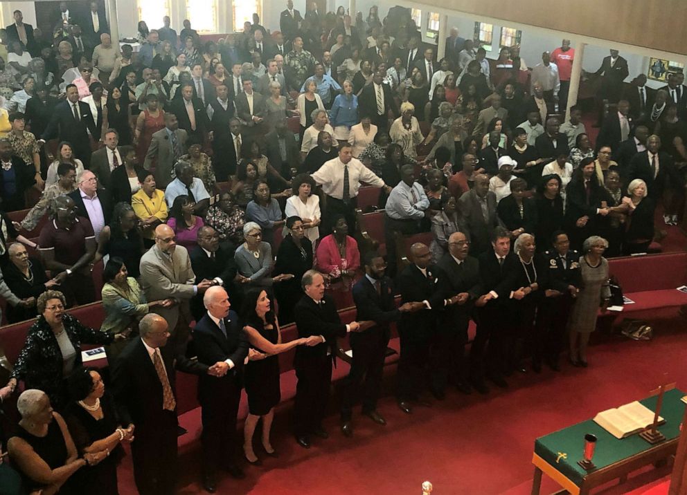 PHOTO:Presidential candidate and former Vice President Joe Biden, left front, joins the congregation of 16th Street Baptist Church in Birmingham, Alabama, as they sing "We Shall Overcome" at Sunday worship, Sept. 15, 2019. 