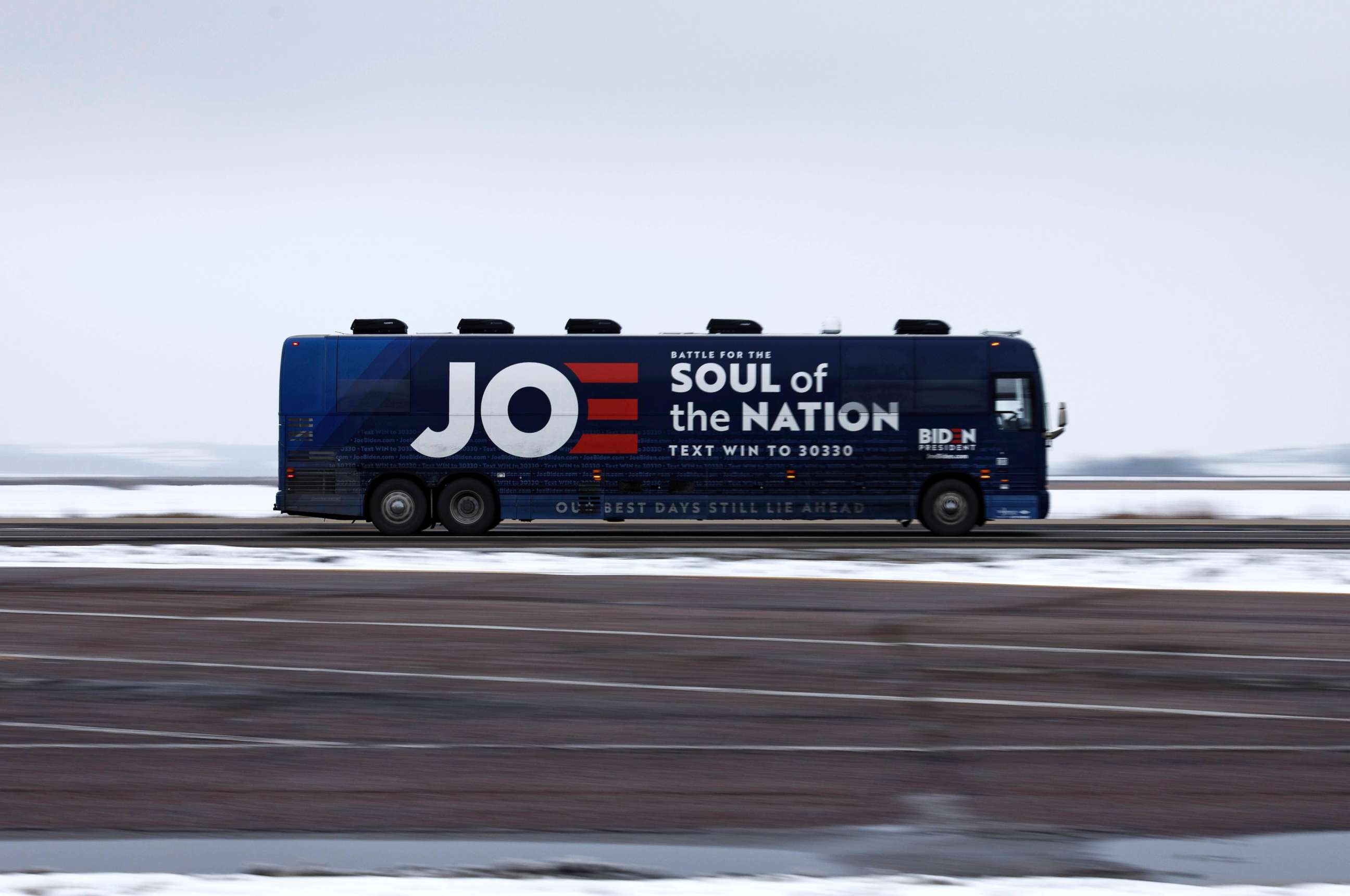 PHOTO: The campaign bus of former Vice President Joe Biden, a 2020 Democrat candidate for president, rolls down an interstate in Iowa, Jan. 29, 2020, north of Council Bluff, Iowa.