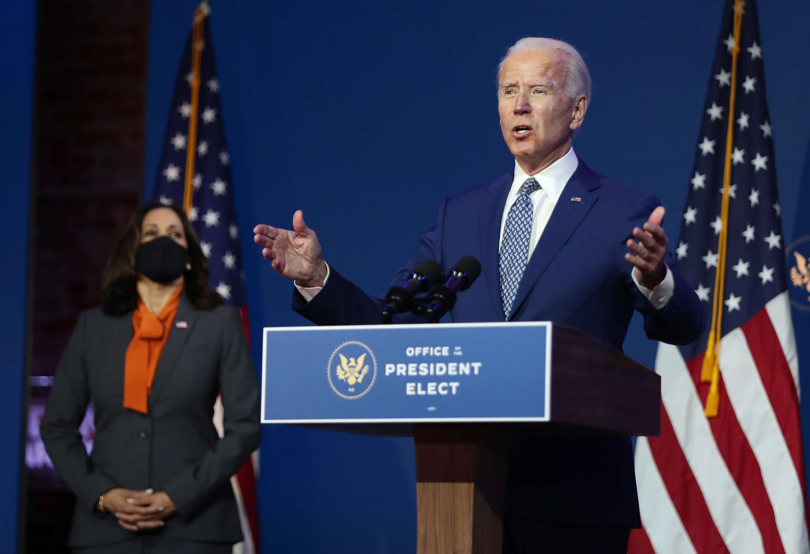 PHOTO: President-elect Joe Biden speaks to the media while flanked by Vice President-elect Kamala Harris, at the Queen Theater after receiving a briefing from the transition COVID-19 advisory board on Nov. 9, 2020 in Wilmington, Del.