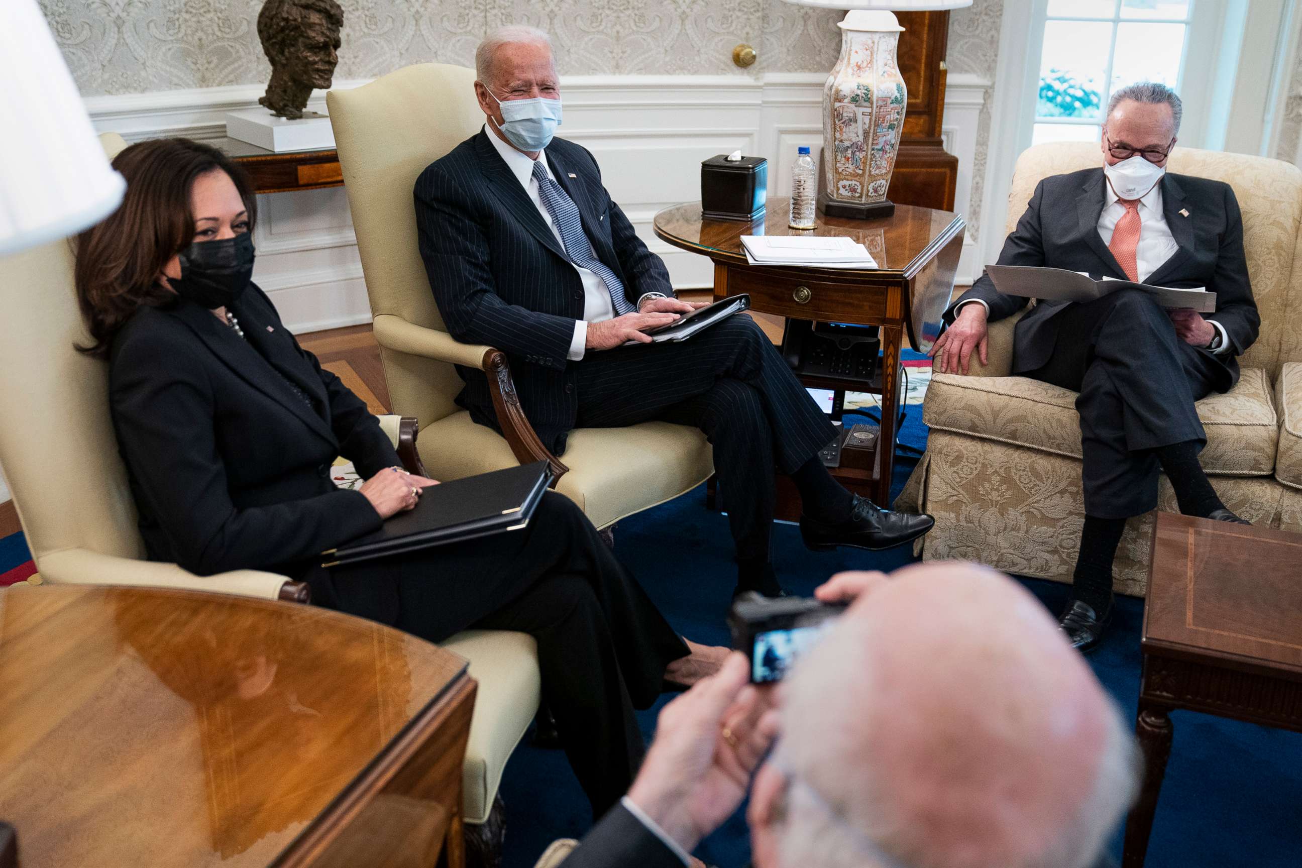 PHOTO: Sen. Patrick Leahy takes a photo Vice President Kamala Harris, President Joe Biden, and Senate Majority Leader Sen. Chuck Schumer, during a meeting to discuss a coronavirus relief package, in the Oval Office of the White House, Feb. 3, 2021.