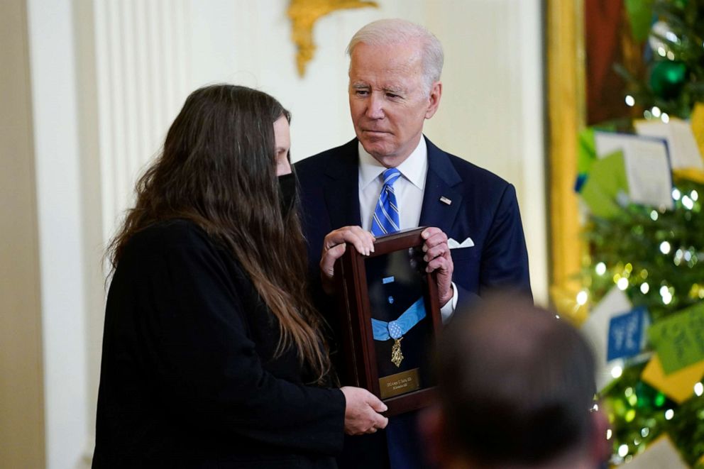PHOTO: President Joe Biden presents the Medal of Honor to Army Sgt. First Class Alwyn C. Cashe for his actions in Iraq, as his widow Tamara Cashe accepts the posthumous recognition during an event at the White House, Dec. 16, 2021, in Washington.