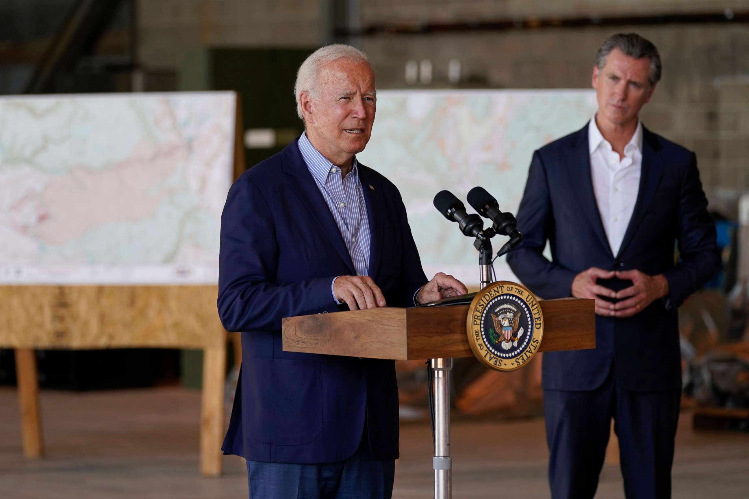 PHOTO: President Joe Biden speaks about recent wildfires, at Sacramento Mather Airport, Monday, Sept. 13, 2021, in Mather, Calif., as California Gov. Gavin Newsom listens.