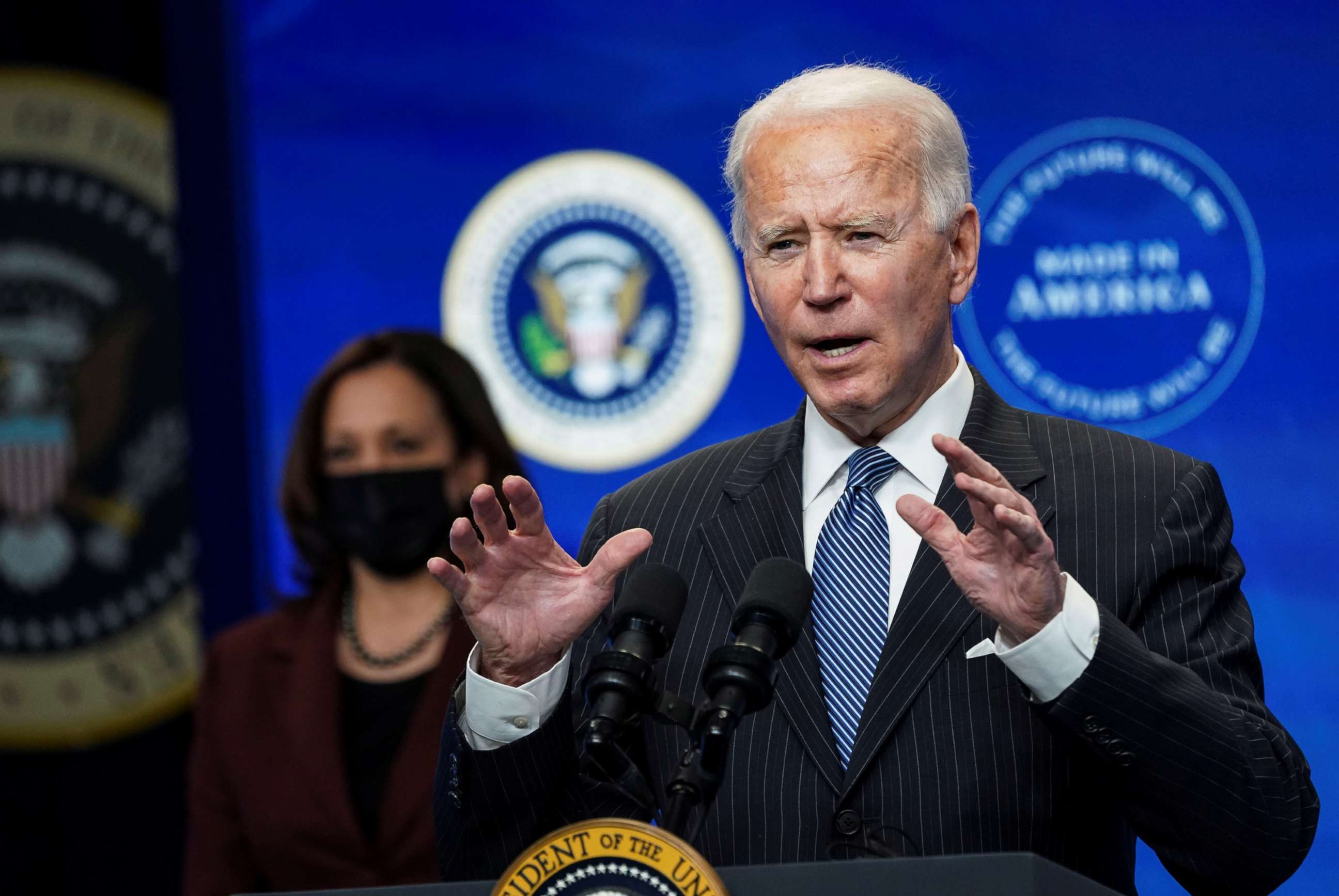 PHOTO: President Joe Biden speaks about administration plans to strengthen American manufacturing as Vice President Kamala Harris listens in the South Court Auditorium at the White House in Washington, D.C., Jan. 25, 2021.