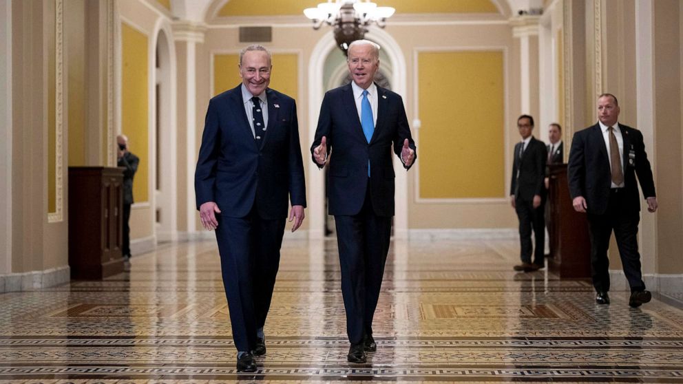 PHOTO: President Joe Biden walks with Senate Majority Leader Chuck Schumer as he arrives to meet with Senate Democrats for a strategy session on his upcoming budget at the Capitol in Washington, March 2, 2023.