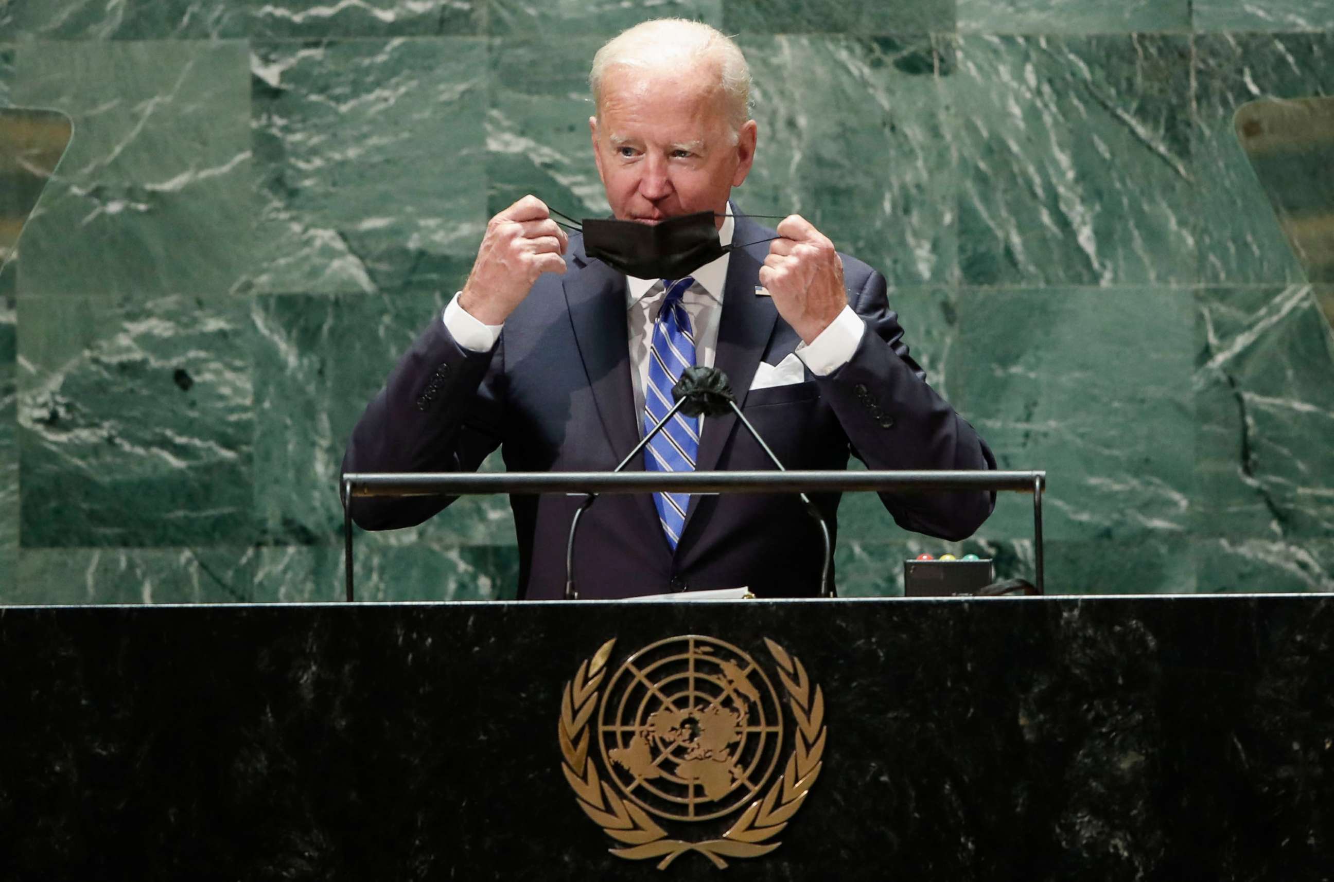 PHOTO: President Joe Biden takes off his protective face mask before speaking at the 76th Session of the UN General Assembly, Sept. 21, 2021, in New York.