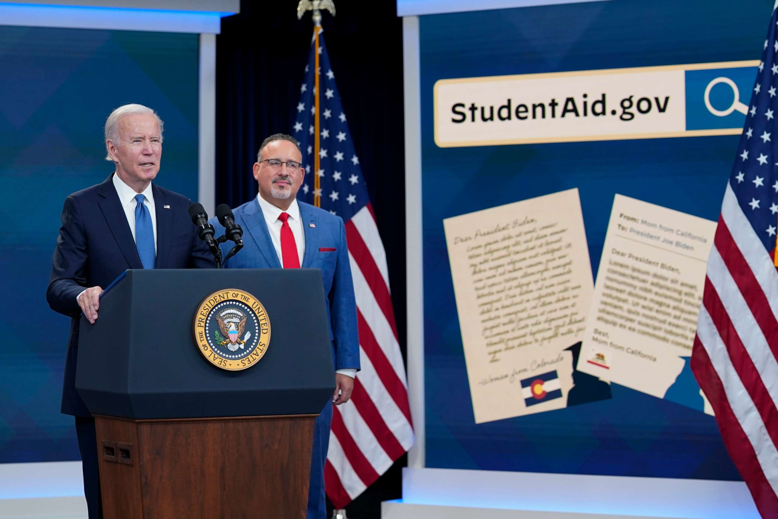 PHOTO: President Joe Biden speaks about the student debt relief portal beta test as Education Secretary Miguel Cardona listens in the South Court Auditorium on the White House complex in Washington, Oct. 17, 2022.