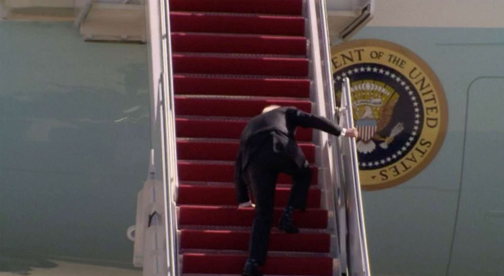 PHOTO: President Joe Biden stumbles while walking up the steps of Air Force One at Joint Base Andrews, Md., March 19, 2021, for a trip to Georgia.