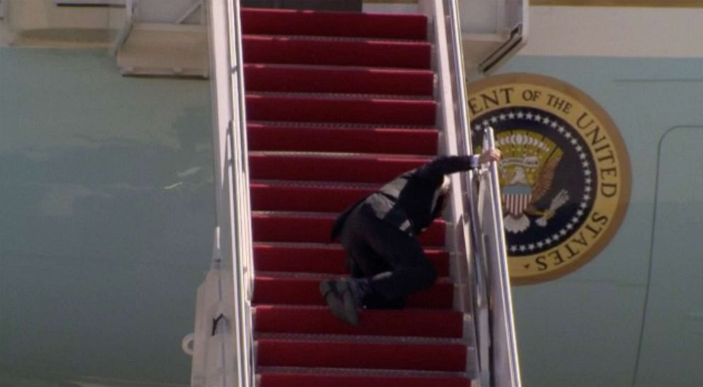 PHOTO: President Joe Biden stumbles while walking up the steps of Air Force One at Joint Base Andrews, Md., March 19, 2021, for a trip to Georgia.