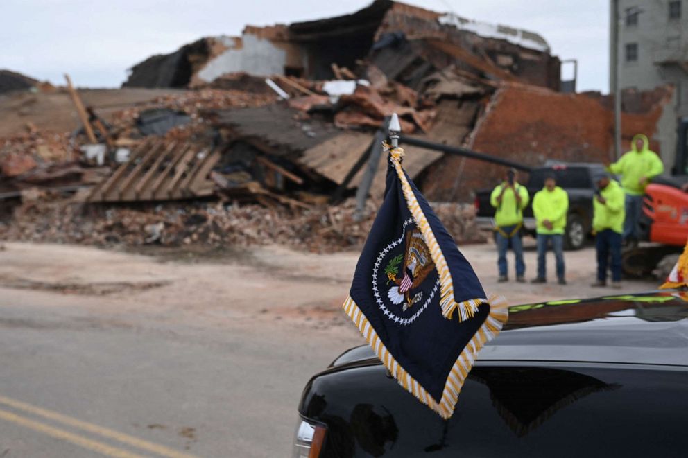 PHOTO: The vehicle carrying President Joe Biden drives past rubble created by a tornado in Mayfield, Ky., on Dec. 15, 2021.