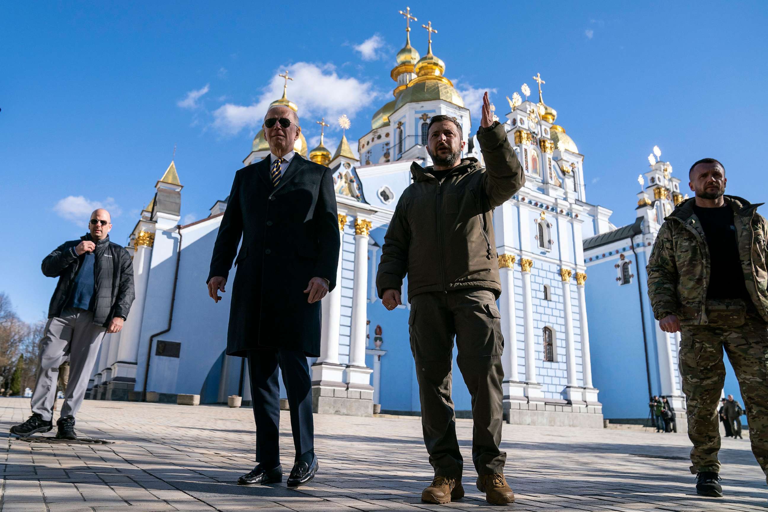 PHOTO: US President Joe Biden (C-L) walks with Ukrainian President Volodymyr Zelensky (C-R) at St. Michael's Golden-Domed Cathedral, Feb. 20, 2023, in Kyiv, Ukraine.