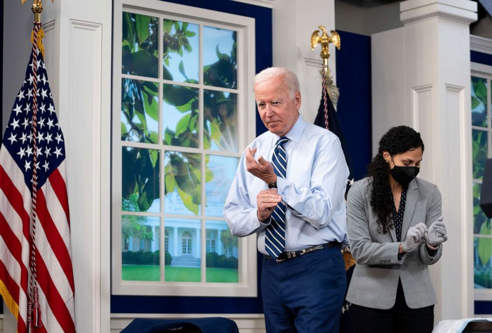 PHOTO: President Joe Biden buttons his shirt sleeve after receiving a COVID-19 booster shot in the South Court Auditorium of the Eisenhower Executive Office Building on the White House grounds in Washington, Sept. 27, 2021.