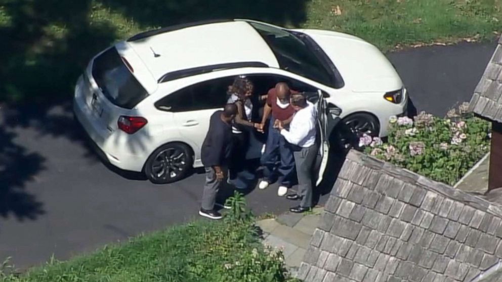 PHOTO: Bill Cosby is assisted as he exits the car that picked him up after he was released from the State Correctional Institution at Phoenix in Collegeville, Pa., June 30, 2021.