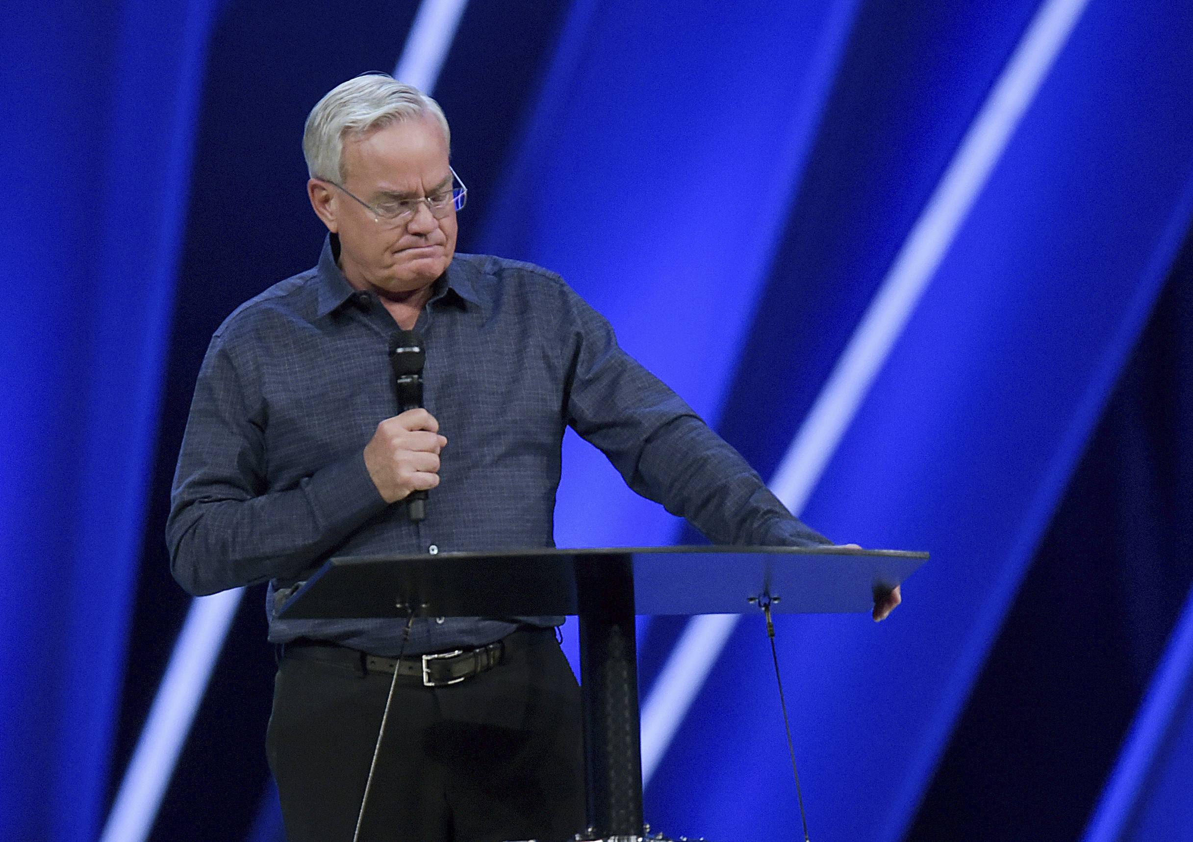 PHOTO: Willow Creek Community Church Senior Pastor Bill Hybels stands before his congregation, April 10, 2018, in South Barrington, Ill., where he announced his early retirement effective immediately.