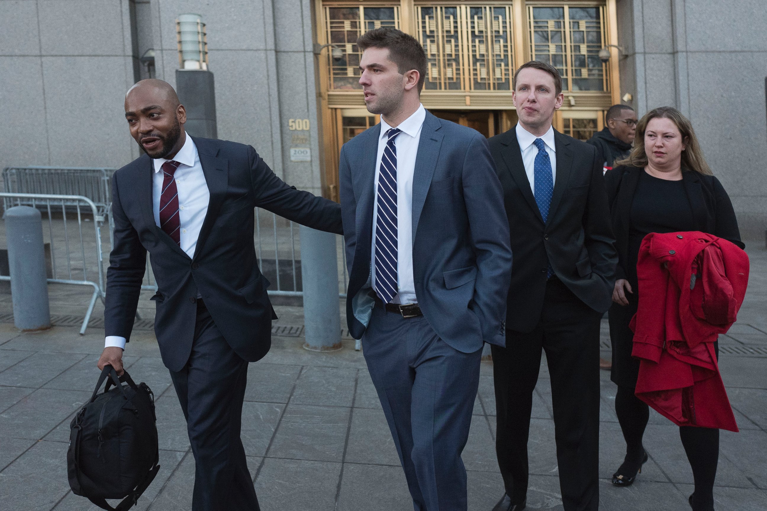 Billy McFarland, center, accompanied by his attorney Randall Jackson, left, leaves federal court after pleading guilty to wire fraud charges, Tuesday, March 6, 2018, in New York.