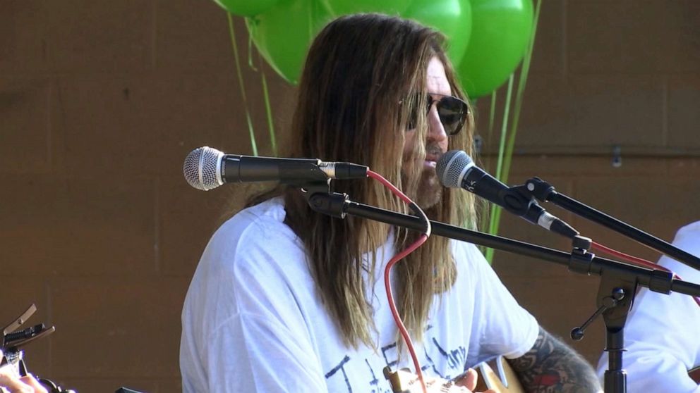 PHOTO: Billy Ray Cyrus performs during a vigil for 16-year-old Channing Smith, after he took his own life, in Coffee County, Tennessee.