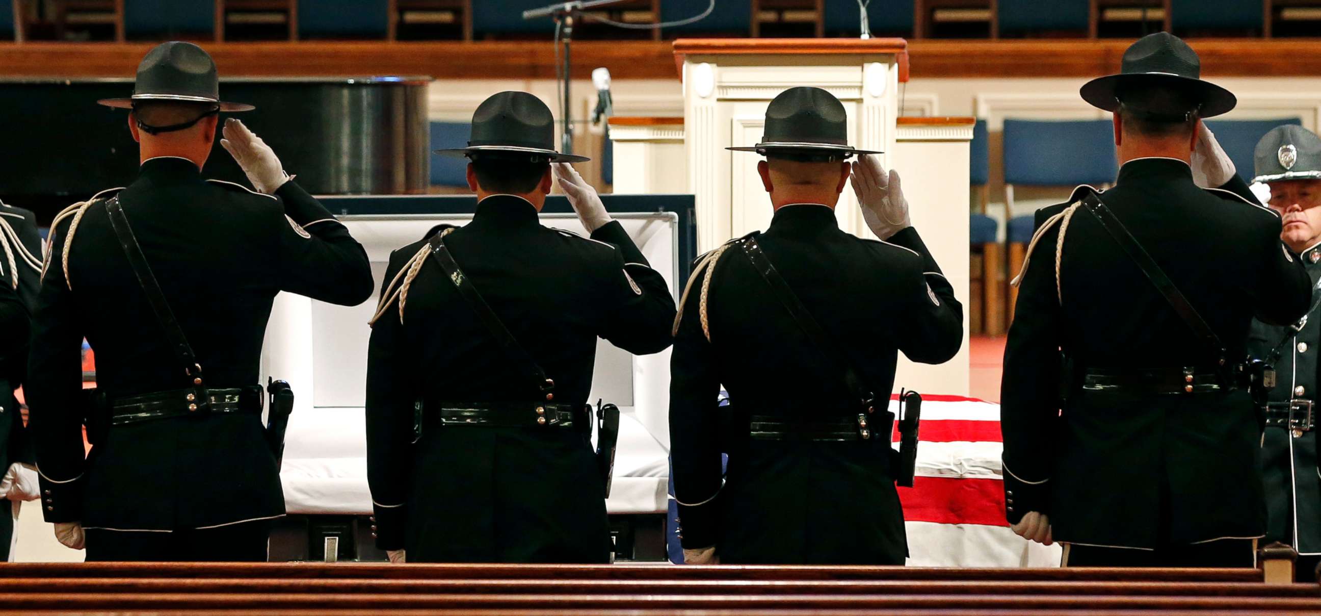 PHOTO:Members of the Biloxi Police Department Honor Guard salute the body of officer Robert McKeithen at the First Baptist Church of Biloxi, Miss., May 13, 2019.