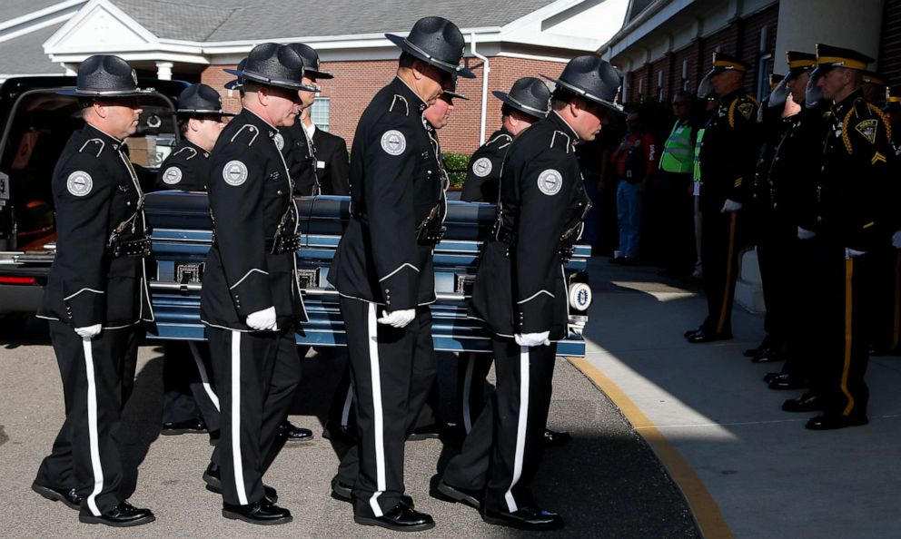 PHOTO: Members of the Biloxi Police Department Honor Guard escort the body of officer Robert McKeithen, into the First Baptist Church of Biloxi, Miss., May 13, 2019.