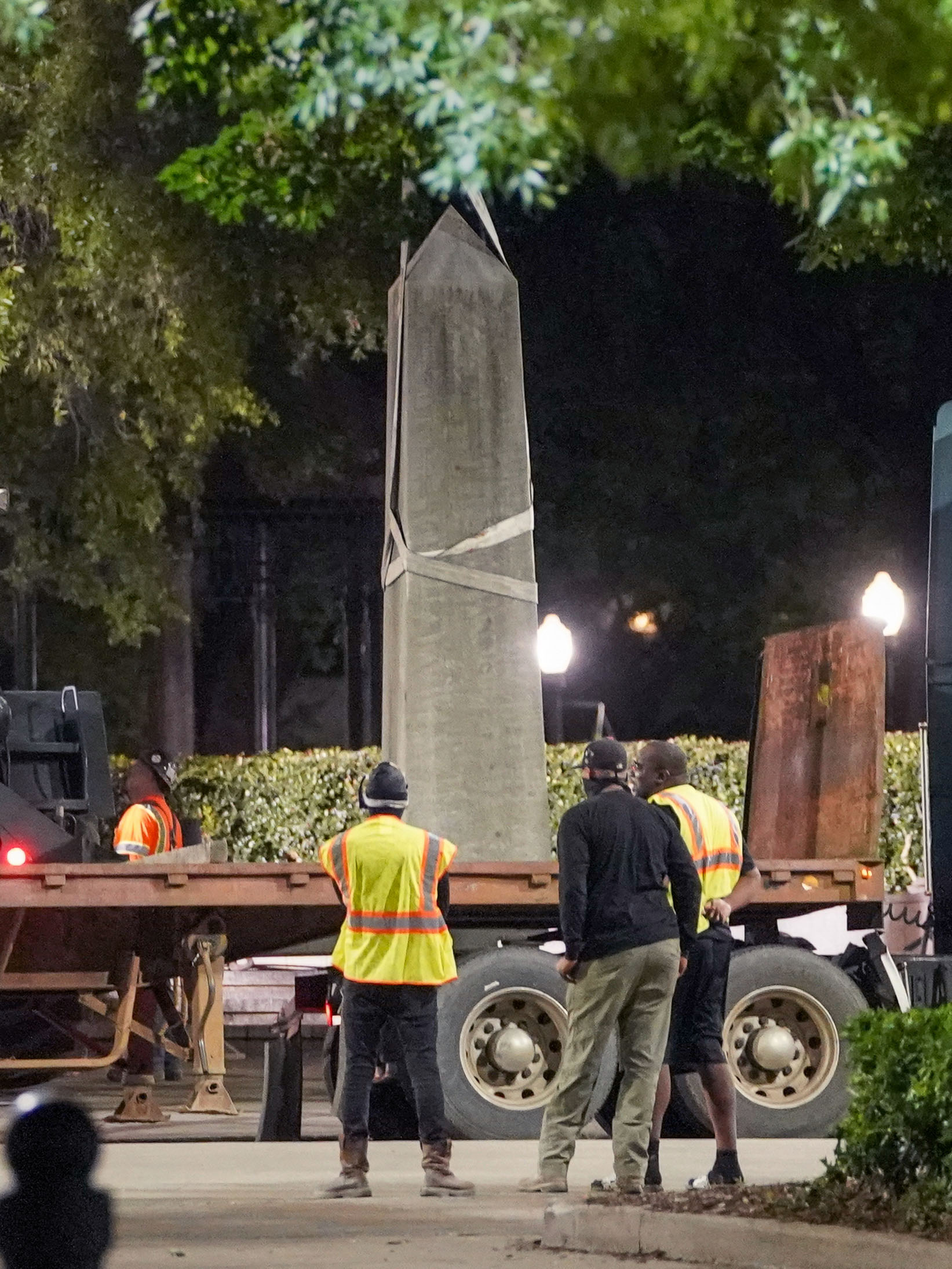 PHOTO: Workers remove a Confederate monument, June 1, 2020, in Birmingham, Ala., after demonstrators failed to knock it down during protests over the death of George Floyd at Linn Park.